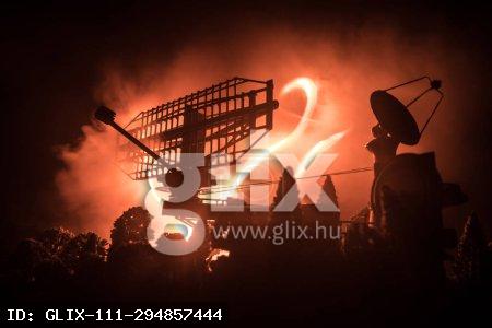 Silhouettes of satellite dishes or radio antennas against night sky. Space observatory.