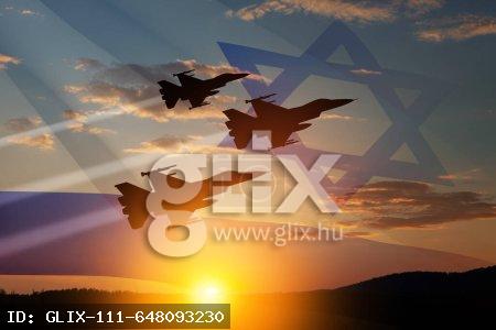 Aircraft silhouettes on background of sunset with a transparent waving Israel flag. Military aircraft. Independence day. Air Force Day.