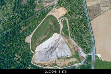 Garbage trucks unload garbage to a landfill, drone photo-stock-foto