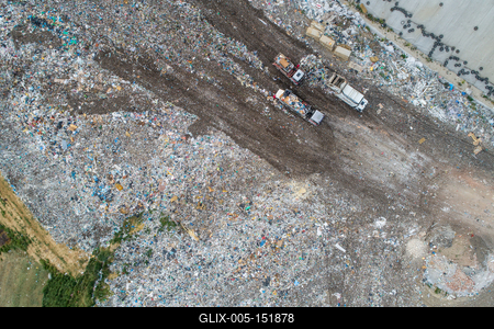 Garbage trucks unload garbage to a landfill, drone photo-stock-foto