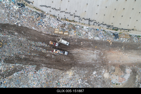 Garbage trucks unload garbage to a landfill, drone photo-stock-foto