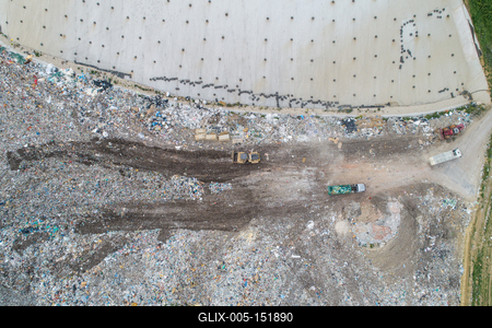 Garbage trucks unload garbage to a landfill, drone photo-stock-foto