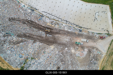 Garbage trucks unload garbage to a landfill, drone photo-stock-foto