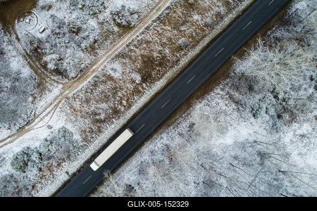 Truck on road with snowy forest in Hungary-stock-foto