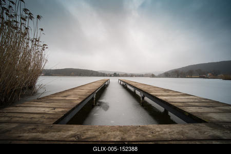 Frozen lake with wooden pier-stock-foto