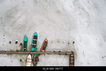 Aerial view of winter frozen lake with wooden pier-stock-foto