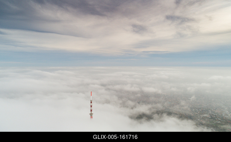TV tower with cloudy and foggy sky-stock-foto