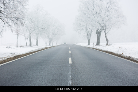 winter warning sign with snow-stock-foto
