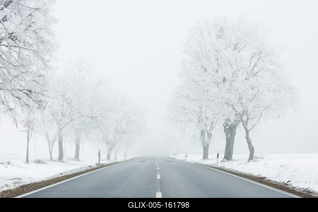 winter warning sign with snow-stock-foto