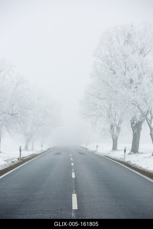 winter warning sign with snow-stock-foto