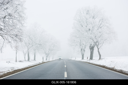 winter warning sign with snow-stock-foto