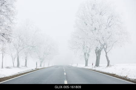 winter warning sign with snow-stock-foto