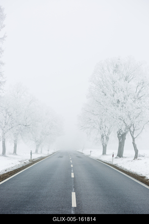 winter warning sign with snow-stock-foto
