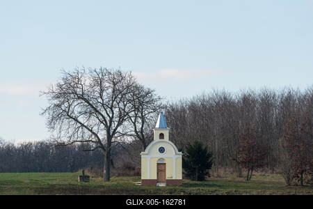 small chapel with a tree-stock-foto