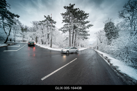 Snowy road with dramatic sky-stock-foto