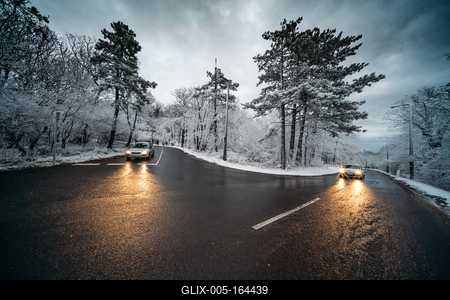 Snowy road with dramatic sky-stock-foto