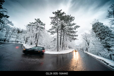 Snowy road with dramatic sky-stock-foto