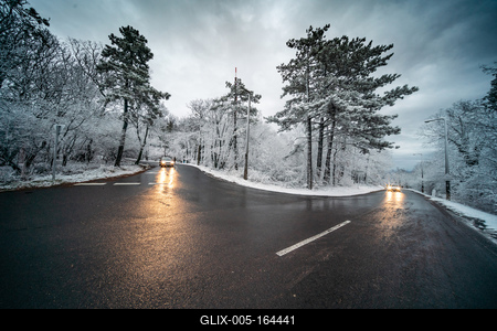 Snowy road with dramatic sky-stock-foto