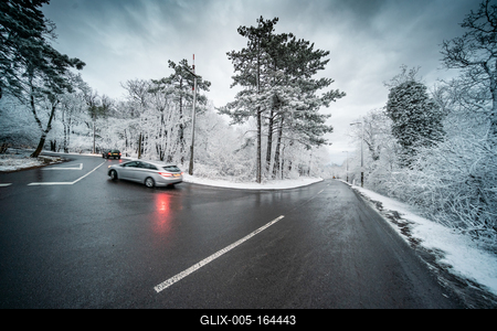 Snowy road with dramatic sky-stock-foto