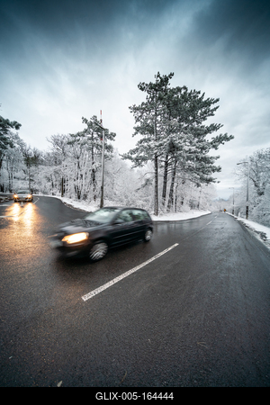 Snowy road with dramatic sky-stock-foto