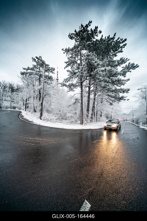 Snowy road with dramatic sky-stock-foto