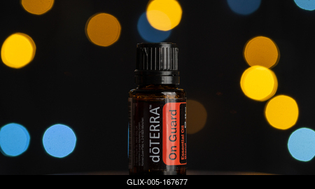 Pecs / Hungray - July 02 2020 - Illustrative editorial image of On guard Doterra Essential Oil for everyday use on a dark shiny background-stock-foto