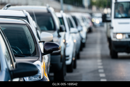 Many cars travelling on a road-stock-foto