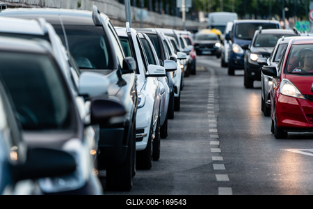 Many cars travelling on a road-stock-foto
