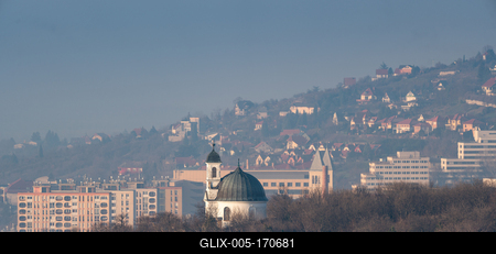 Small chapel in Pecs, Hungary with block houses-stock-foto