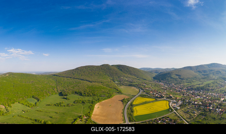 yellow canola field with Mecsek Hills-stock-foto