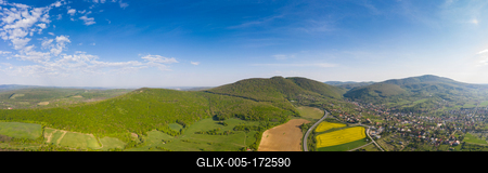 yellow canola field with Mecsek Hills-stock-foto
