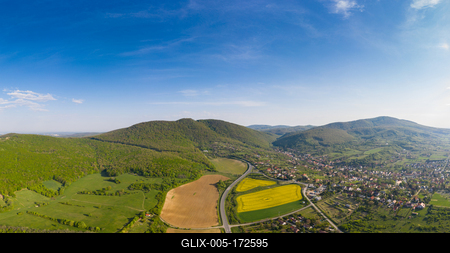 yellow canola field with Mecsek Hills-stock-foto