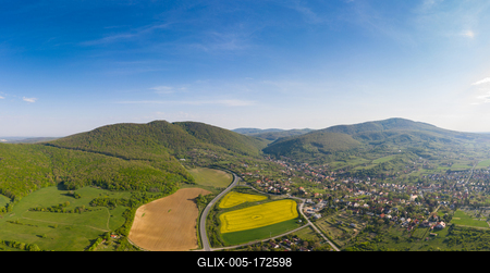 yellow canola field with Mecsek Hills-stock-foto