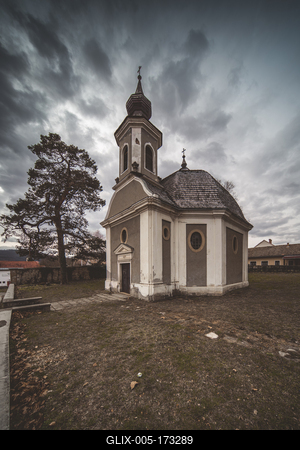 Small chapel with stormy clouds, before rain-stock-foto
