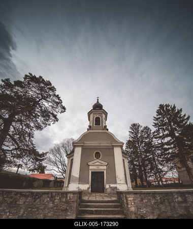 Small chapel with stormy clouds, before rain-stock-foto