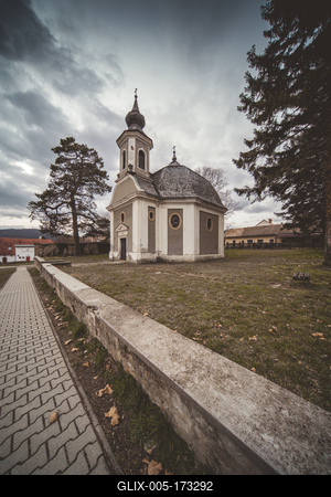 Small chapel with stormy clouds, before rain-stock-foto