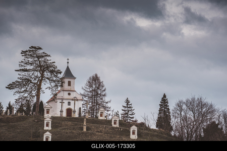Small chapel with stormy clouds, before rain-stock-foto