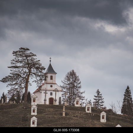 Small chapel with stormy clouds, before rain-stock-foto