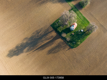 aerial photo of a small chapel with morning sunshine-stock-foto