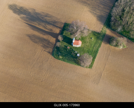 aerial photo of a small chapel with morning sunshine-stock-foto