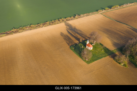 aerial photo of a small chapel with morning sunshine-stock-foto