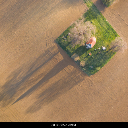 aerial photo of a small chapel with morning sunshine-stock-foto