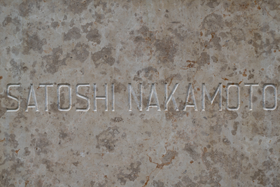 satoshi nakamoto text on a textured marble table-stock-foto