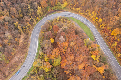 aerial view of Curvy road with autumn forest-stock-foto