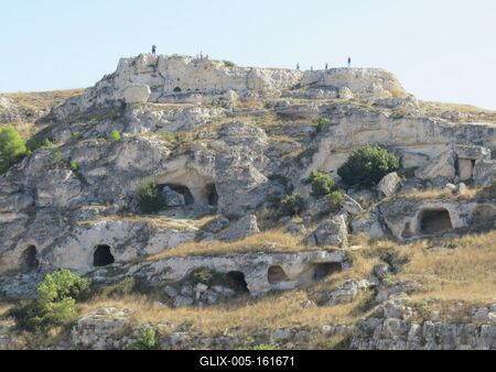 Sziklába vájt kunyhók Materában - Olaszország-stock-foto
