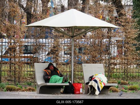 Budapest - Spring  - Homeless people on sunbathing bench-stock-foto