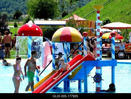Children enjoy the slide and water on the Aqua City beach in Zalaegerszeg - Hungary-stock-foto