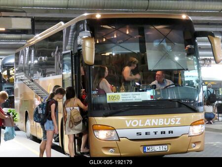 Passengers boarding a long-distance bus at Puskás Ferenc stadium Volánbusz station - Budapest-stock-foto