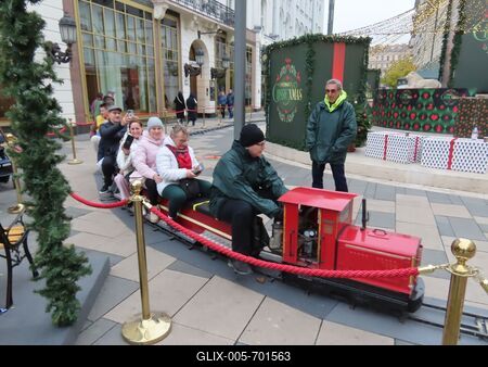 People traveling on a small train - Christmas fair - Budapest-stock-foto