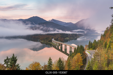 Sylvenstein Lake and bridge surrounded by the morning mist at dawn. Bad TÃ¶lz-Wolfratshausen district, Bavaria, Germany.-stock-foto
